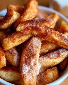 Delicious air fryer apple fries served in a bowl for snacking